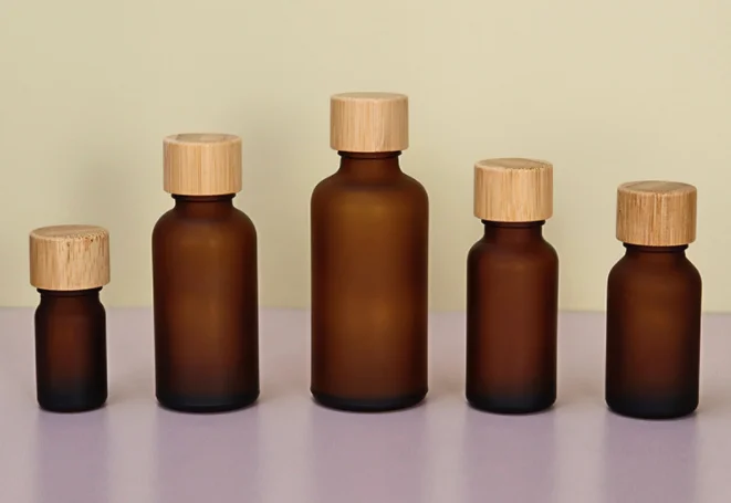 Wholesale 140pcs 100ml amber frosted glass bottle with bamboo screw cap