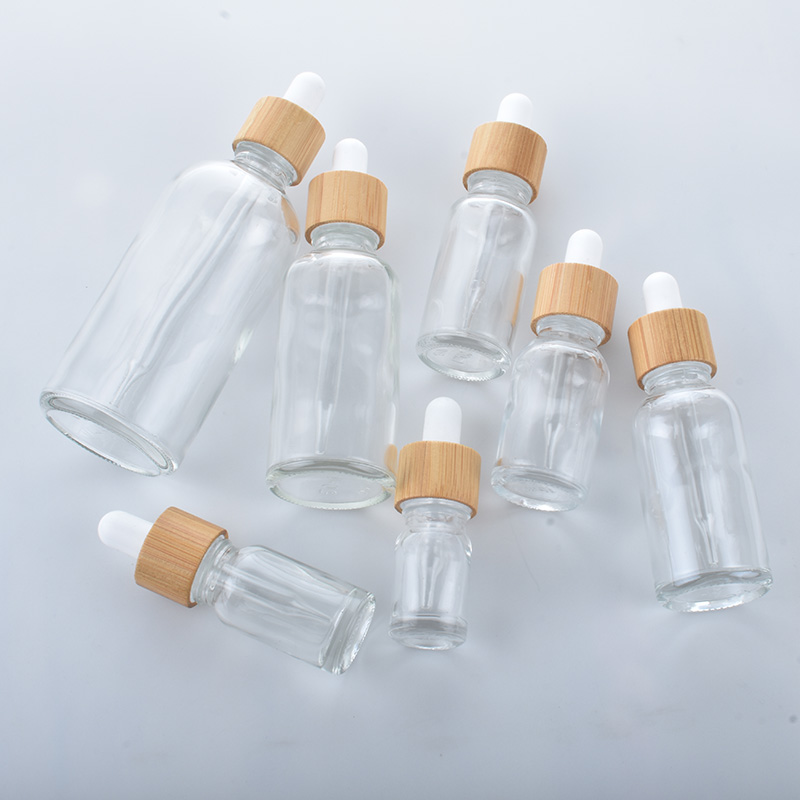 5ML-100ML Hot Sale Custom Glass Essential Oil Dropper Bottles For Cosmetic Skin Care Pipette Container Packaging With Bamboo Lid