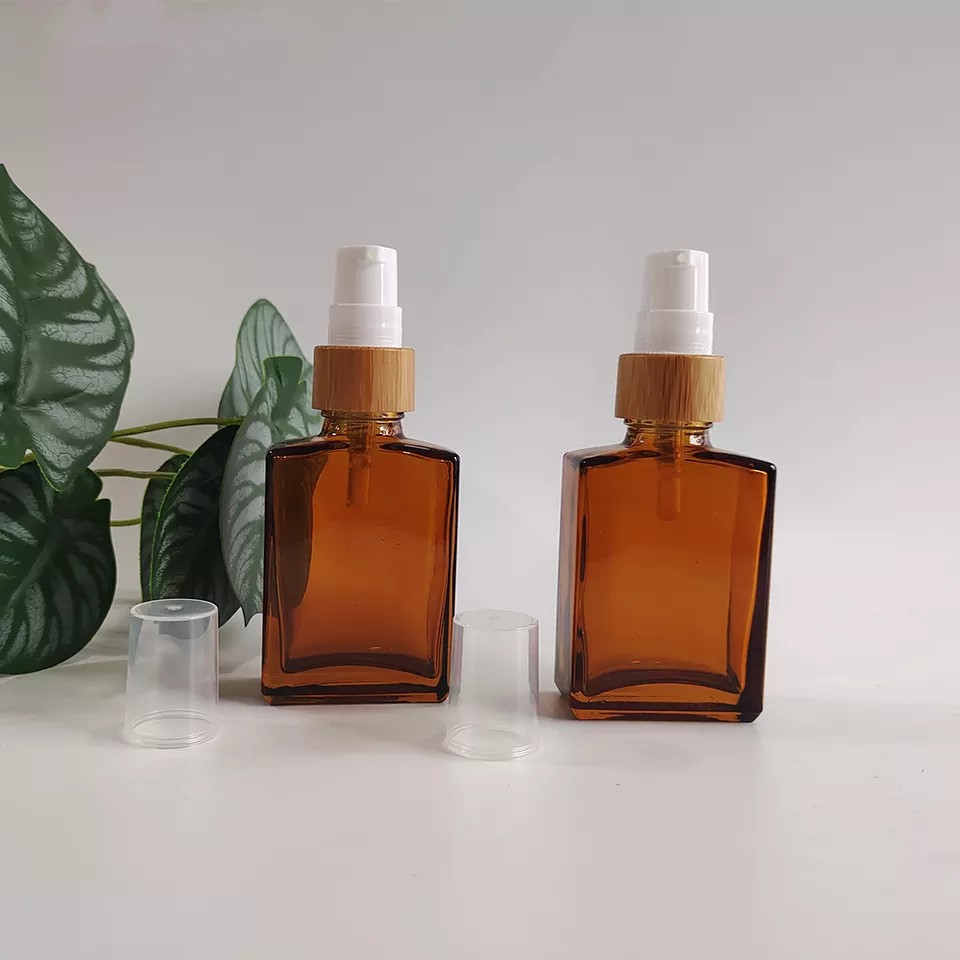 Wholesale 30ml 1oz Pump Cosmetic Amber Square Empty Glass Lotion Soap Bottles with Bamboo Cap Cosmetics Refillable Travel Bottle