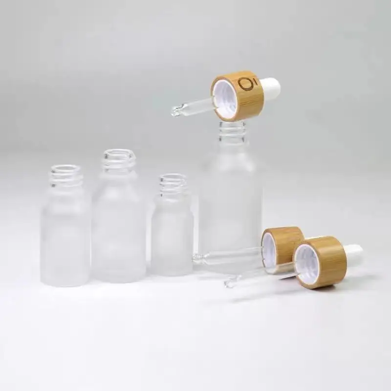 Essential oil with bamboo lid empty perfume bottles Frosted Clear Essential Oil Glass Dropper Bottle With Bamboo Dropper Cap